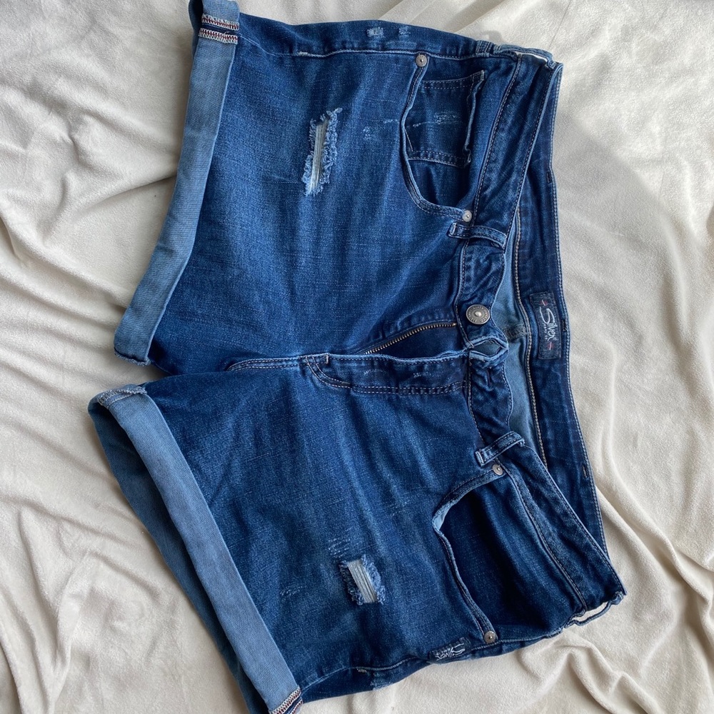 Silver jean shorts, distressed, folded